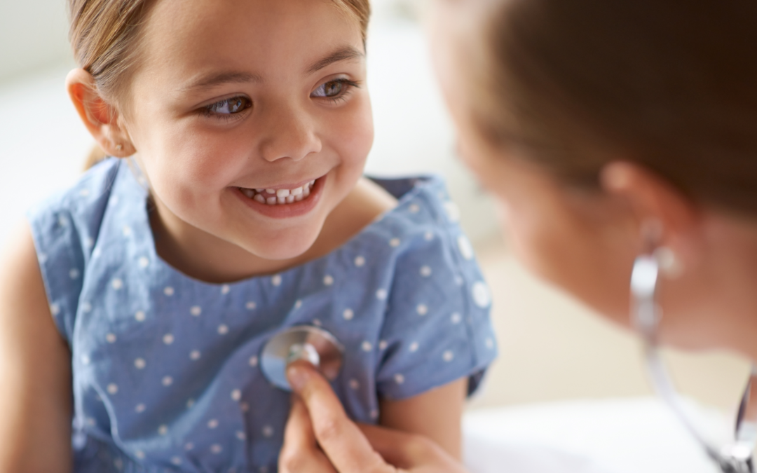 physician listening to child's heart